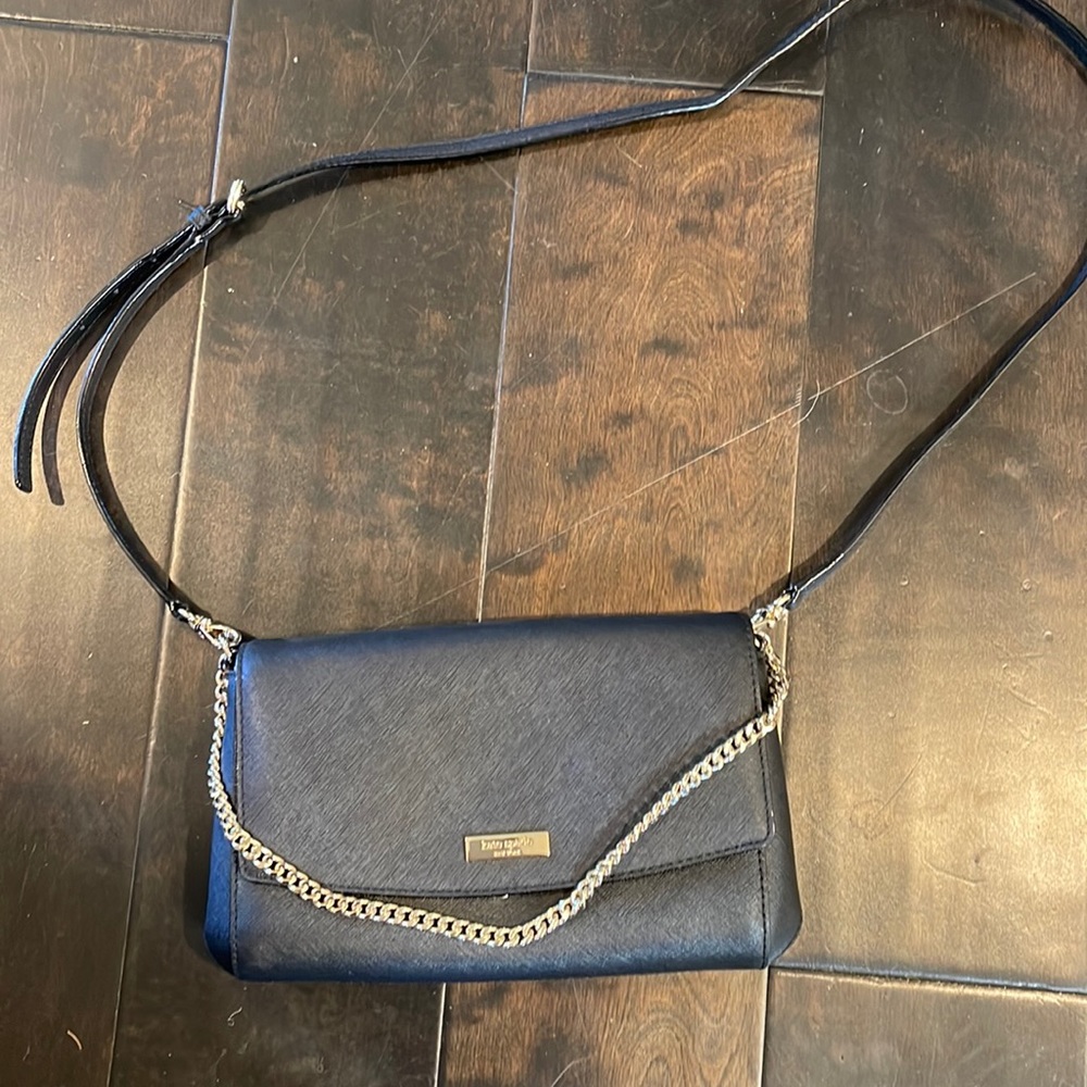 Kate Spade Black Crossbody/clutch style bag with gold chain or crossbody strap.